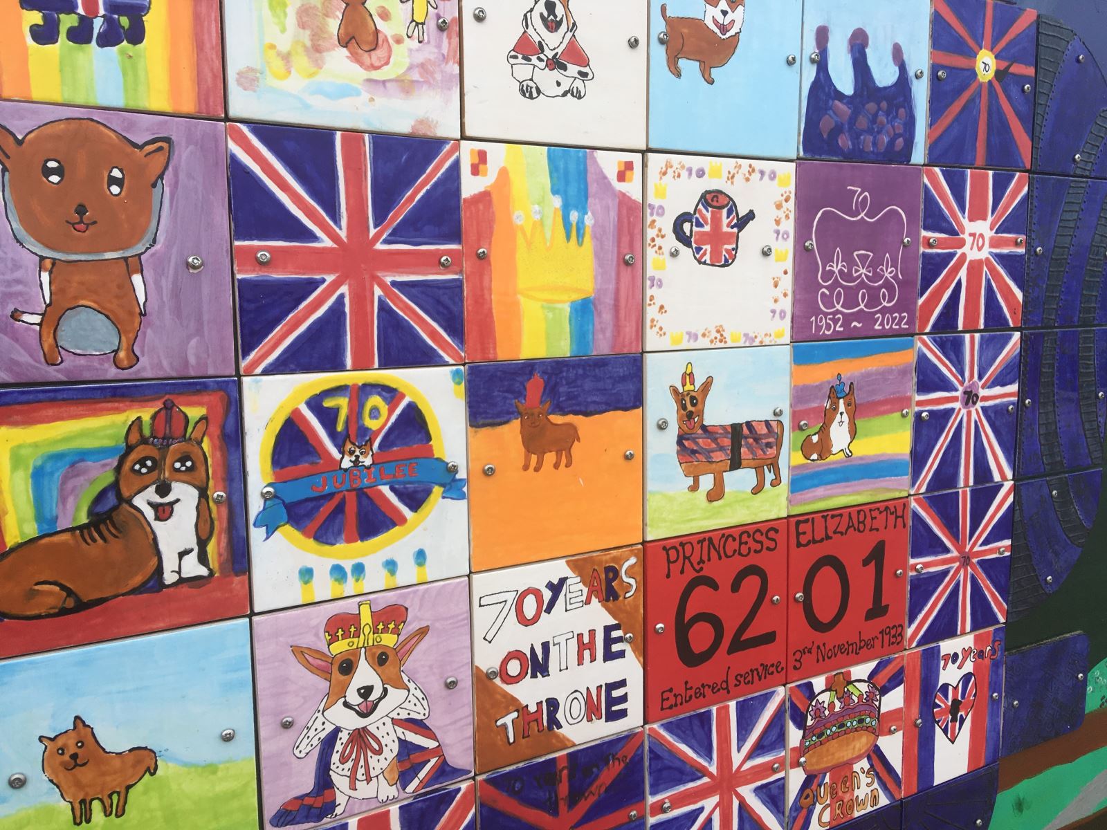 Ceramic tiles with corgis on the Swanage Jubilee Mural celebrating the Queen's Platinum Jubilee